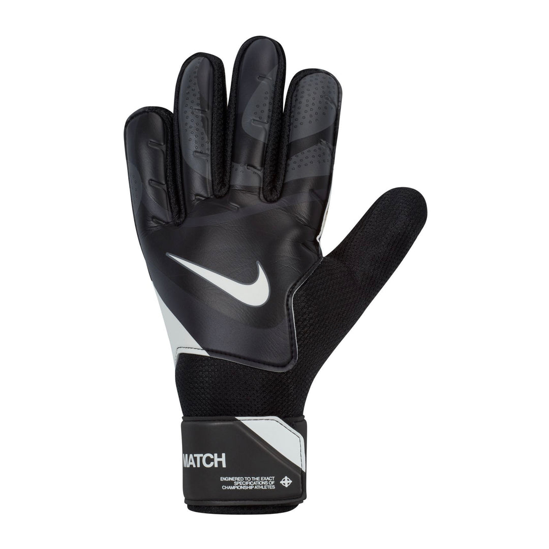 Nike GK Match soccer gloves in black, dark grey, and white with padded palms and adjustable wrist straps.