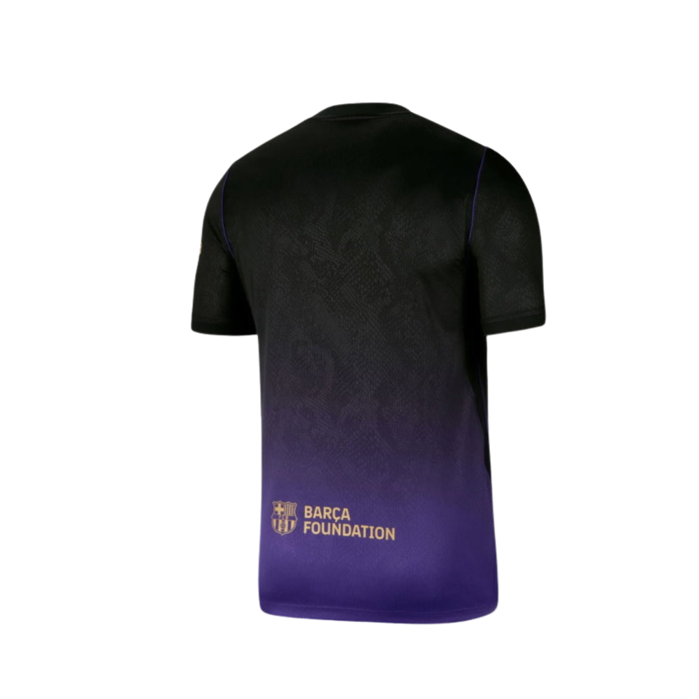 Nike FC Barcelona youth stadium away shirt 26/27, featuring team colors and Nike logo, displayed on a flat surface.